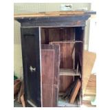 Wooden cupboard and contents