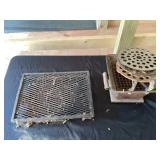Metal cooking stove, and grate
