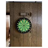 Dart board with darts