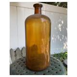One gallon brown glass jug