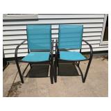 Two blue patio chairs