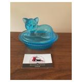 Blue glass cat on a nest dish