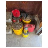 Assorted gas cans and funnels