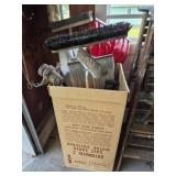 Tote of brooms and shovels