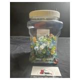 Plastic canister of marbles