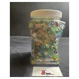 Plastic canister of marbles