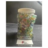 Plastic canister of marbles