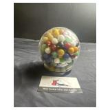 Round glass jar of marbles
