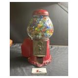 Vintage glass gimbal machine full of marbles