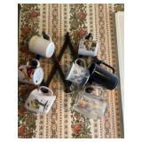 Assorted coffee cups and holder