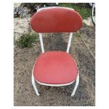Metal framed chair on wheels