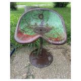 Vintage metal implement seat on stand
