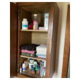 Contents of cupboard and wicker basket