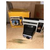 The Handle Kodak instant camera