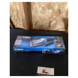 Heated ice scraper