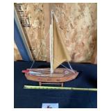 Wooden sailboat figurine