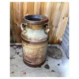 Metal milk can approximately 24 inches tall