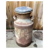 Metal milk can approximately 26 inches tall