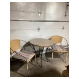 Wicker table with last cop and two chairs