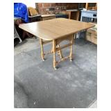 Drop leaf table on wheels Approximately 40" x 36