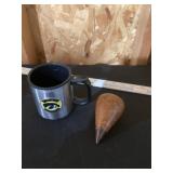 Hawkeye cup, and wood plumb Bob