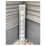 Wooden welcome sign approximately 48 inches tall