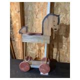 Wooden rolling horse