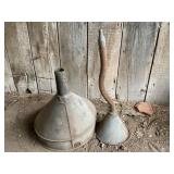 Two galvanized funnels