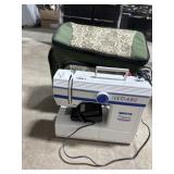 White classic sewing machine in rolling bag