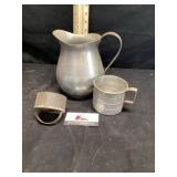 Aluminum water, pitcher, and a measuring cup