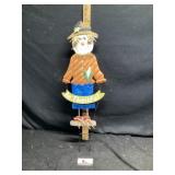 Metal scarecrow sign approximately 31 inches tall