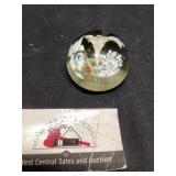 Hand blown glass paperweight with floral designs