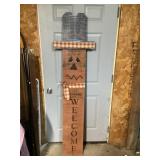 The wooden scarecrow decor approximately 6 feet