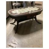Glass top oval table approximately 20 x 38 x 18