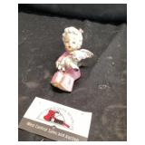 Vintage ceramic angel on a shelf