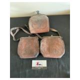 Vintage leather tooled clutches