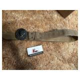 Brass lion belt buckle on belt