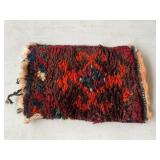 Small fragment of woven rug