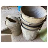 Galvanized buckets and oil can