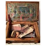 Wooden sewing box full of supplies