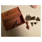 Wooden box of brass bells