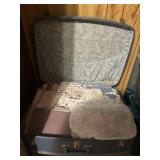 Vintage suitcase with misc fabric