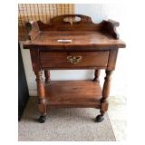 Wooden stand on wheels