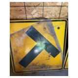 T road sign