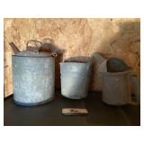 Galvanized oil can and small bucket