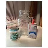 Buttons, sewing machine oil, jar
