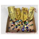 Assorted marbles and pouches for marbles