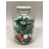 Gallon jar of colored spools