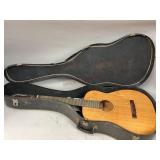 Guitar in case as found