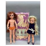 Two dolls in one box